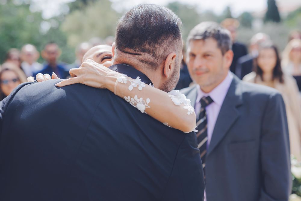 bride arrives hug